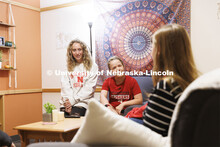 Students socializing in a University Suites Residence Hall room. Housing Photo Shoot in University S