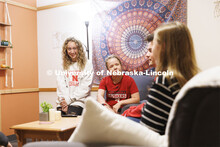 Students socializing in a University Suites Residence Hall room. Housing Photo Shoot in University S