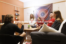 Students socializing in a University Suites Residence Hall room. Housing Photo Shoot in University S