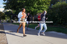 Meyri Ibrahim runs towards the clocktower to find the next clue at the Homecoming Traditions Race. T