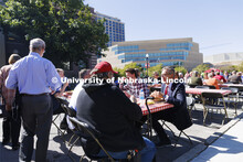 Chancellor Ronnie Green talks with people on R Street attending the all-employee picnic. The picnic 