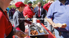 Chancellor Ronnie Green talks with people on R Street attending the all-employee picnic. The picnic 