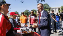 Chancellor Ronnie Green smiles as he works his way through the food line on R Street for the all-emp