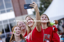 Students pose for a selfie at the Homecoming Parade and Cornstalk. September 30, 2022. 