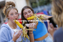 Ella Bowman and Megan Vrooman pose for a friend’s camera at Cornstalk. Homecoming Parade and Corns
