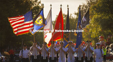 The ROTC color guard marches down R Street. Homecoming Parade and Cornstalk. September 30, 2022. 