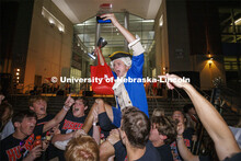 Aidan Bakke, a freshman in business administration, is lifted up by his Sigma Chi fraternity brother