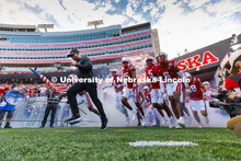 Interim coach Mickey Joseph leads the Husker football team onto the field. Nebraska vs. Indiana foot