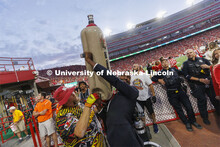 Members of the Homecoming Court get the chance to launch a hotdog with Der Viener Schlinger. Nebrask