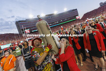 Members of the Homecoming Court get the chance to launch a hotdog with Der Viener Schlinger. Nebrask