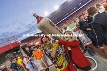 Members of the Homecoming Court get the chance to launch a hotdog with Der Viener Schlinger. Nebrask