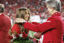 Newly crowned homecoming royalty Emily Hatterman has a medallion placed over her by Jane Green. Nebr