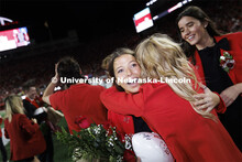Newly crowned homecoming royalty Emily Hatterman gets a hug as she leaves the field. Nebraska vs. In
