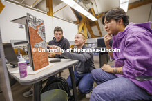 Assistant Professor Matthew Miller critiques student's projects. Design studios in Architecture Hall
