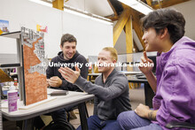 Assistant Professor Matthew Miller critiques student's projects. Design studios in Architecture Hall