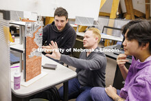 Assistant Professor Matthew Miller critiques student's projects. Design studios in Architecture Hall