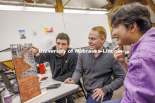 Assistant Professor Matthew Miller critiques student's projects. Design studios in Architecture Hall