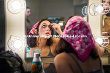 Aurora Villarreal applies stage makeup before the Shakesfear Haunted house on October 12. As a longt