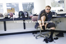 Jackson Wells puts on his socks and shoes as he costumes up to become The Gravedigger. ShakesFear pr