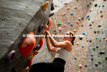Students climb a boulder route during the League of Extraordinary Boulderers. League of Extraordinar