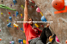 Students climb a boulder route during the League of Extraordinary Boulderers. League of Extraordinar
