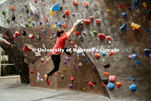 Students climb a boulder route during the League of Extraordinary Boulderers. League of Extraordinar