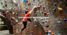Students climb a boulder route during the League of Extraordinary Boulderers. League of Extraordinar