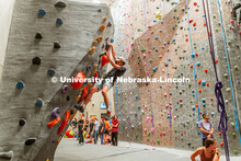Cole Brady, sophomore, climbing a boulder route during the League of Extraordinary Boulderers. Leagu