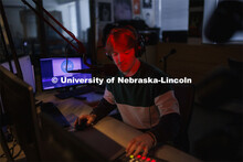 Ryan Luetkemeyer, a sophomore from St. Louis, does the afternoon broadcast from the booth at KRNU. N
