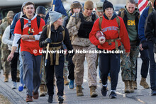 Midshipman Abby Thibodeau and Midshipman Gabrielle Martinez, walk along 84th Street. Nebraska studen