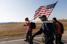Midshipman Cohan Bonow and Ruck Marchers walk along Holdrege Street in eastern Lancaster County. Neb