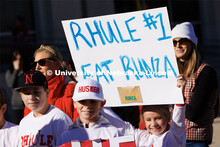 Second grader Elizabeth Owens holds up a sign to welcome Husker head football coach Matt Rhule. Rhul