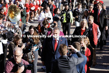 Husker head football coach Matt Rhule is surrounded as he enters east stadium Monday. Rhule is intro