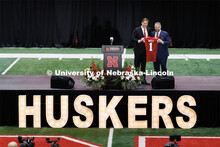 New Husker head football coach and Trev Alberts, vice chancellor and director of athletics, pose wit