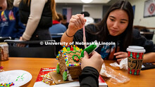 Holly Kerr, student, adding finishing touches to her gingerbread house. Students celebrate the upcom