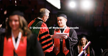 Chancellor Scholar and Elementary Education graduate Brett Foster receives his diplomas from Chancel