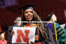 Bouthaina Ibrahim smiles to family and friends after receiving her Journalism and Mass Communication