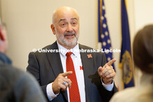 Charles Stoltenow, Dean and Director of Nebraska Extension, talks with staff and coworkers in Agricu