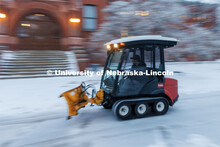 Facilities Maintenance and Operations remove the snow and ice outside of Architecture Hall. Ice and 