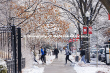Students crossing campus. Ice and snow cover campus. January 19, 2023. 
