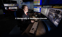 UNLPD Dispatcher Ella England watches a screen as she and fellow dispatcher Desiree Allum, left, wor