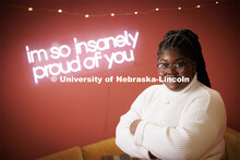 Odelia Amenyah smiles for a photo in the College of Journalism's Experience Lab. Amenyah is a senior