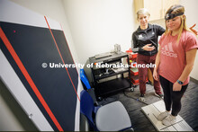Dr. Kate Higgins, an Athletic Neuropsychologist with Husker Athletics, performs a mCOBALT test (a co