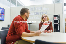Clearthur Mangram, Director of the Explore Center helps a student. February 7, 2023. 