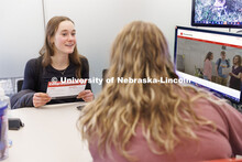 Alexis Dent, a freshman, is all smiles after working with the Explore Center’s Elisa Heide to find