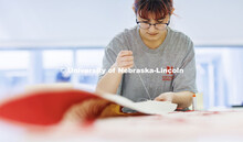 Inas Hskan, a sophomore in Textiles, Merchandizing and Fashion Design and quilt center student worke