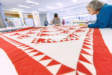 Inas Hskan, a sophomore in Textiles, Merchandizing and Fashion Design and quilt center student worke