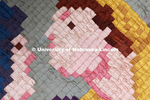 A closeup of  the Ruth and Naomi Quilt sewn by Charles Pratt in the 1930s. The quilt is comprised of