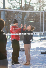 UNL students plays volleyball with friends on Thursday outside the Harper Schramm Smith residence ha