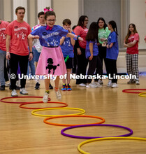Parker Matzen hops through hulahoops at the 2023 HuskerThon. University of Nebraska–Lincoln studen